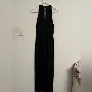 Lightly worn jumper with trinket on collar